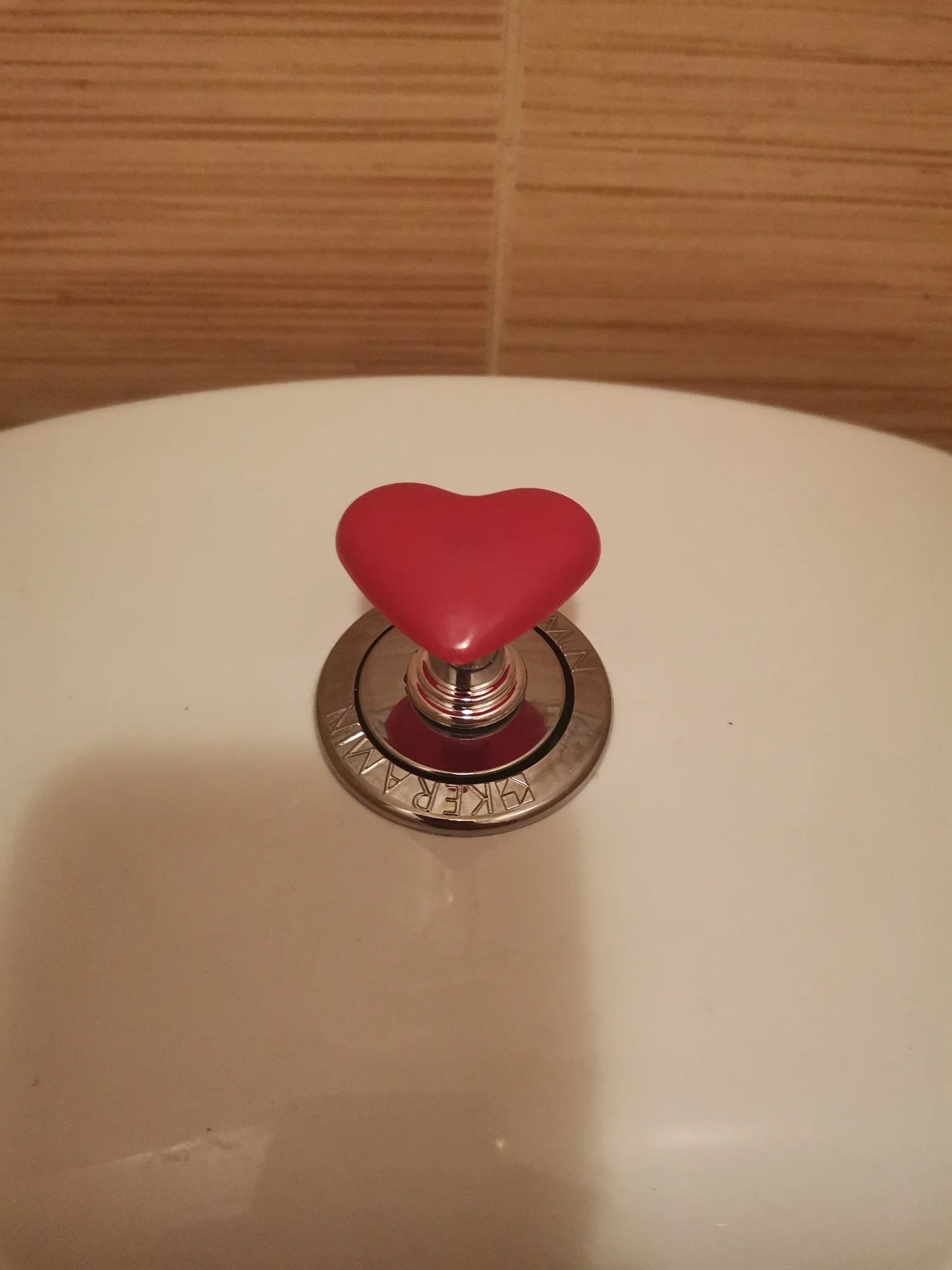 Botón de inodoro corazón