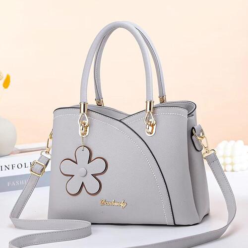BOLSO DE CUERO RETRO CON LLAVERO FLOR