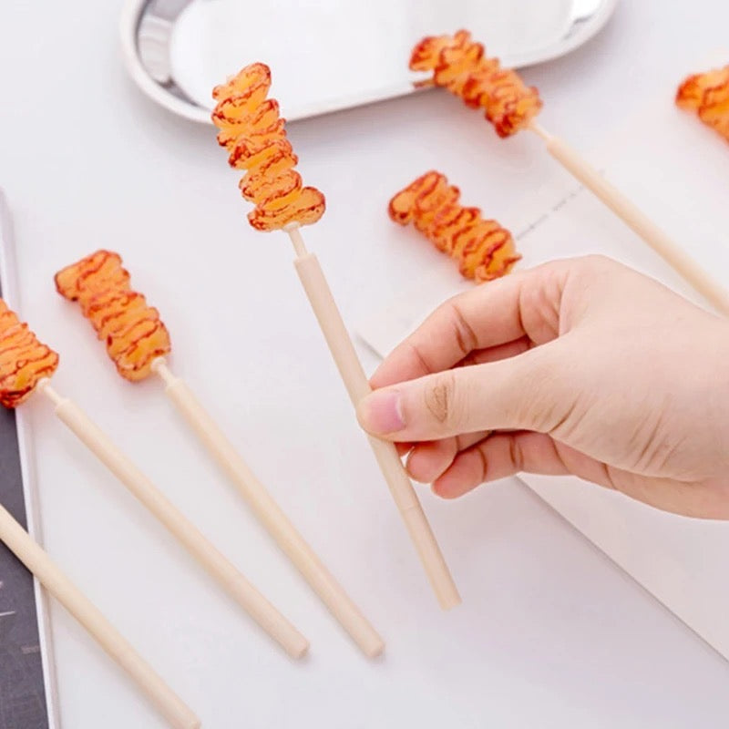 Lapicero en forma de brocheta
