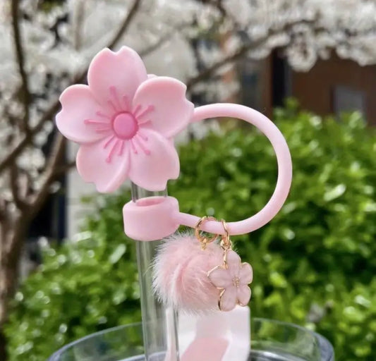 Protector de cañita flor rosa con dije y pompom