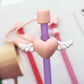 Protector de cañita corazón con alas 🩷 rosado
