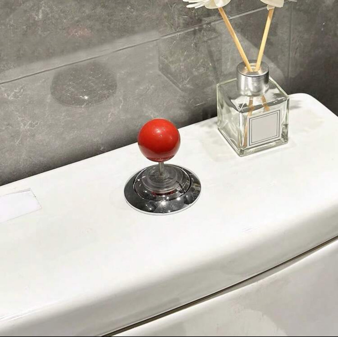 Botón de inodoro